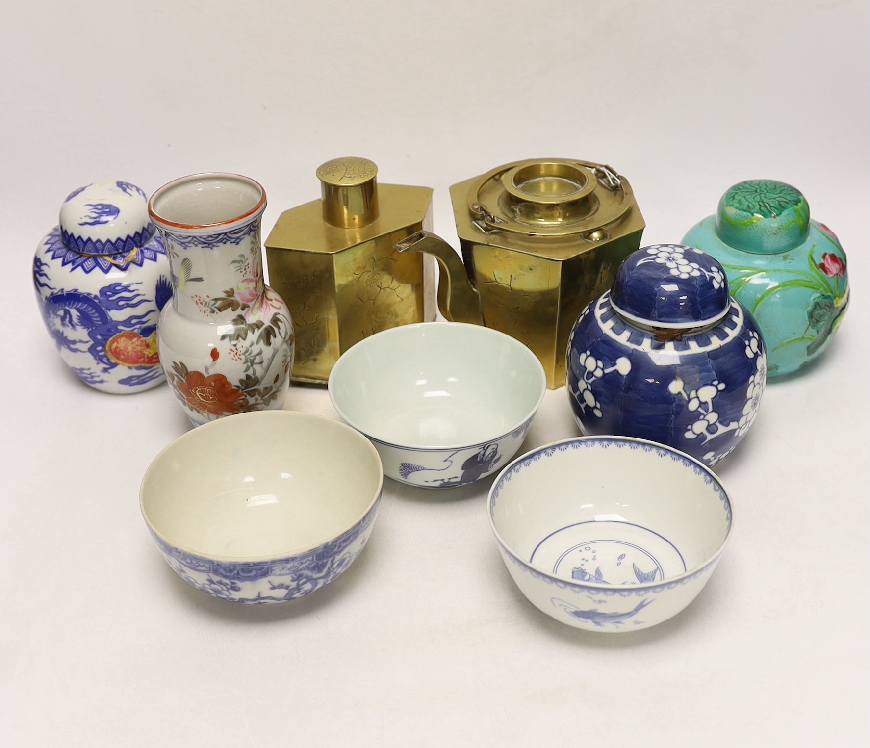 Chinese items including a brass tea caddy and kettle, blue and white porcelain bowls and a Japanese vase